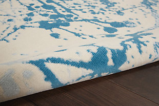 Smart and sophisticated, the jubilant collection presents contemporary rugs with fresh new looks and modern color palettes. Beautifully appealing in pastel shades of pink, blue, and grey, each rug features a durable low-pile construction from low-maintenance, easy-care fibers that will blend perfectly into any casual boho setting. Nature and abstract combine in this dramatic forest-inspired design from the jubilant collection by . Silhouetted limbs in blue and silvery grey spread across an ivory field of low-pile, easy-care fibers, creating an instantly engaging artistic rug that will energize any room in the home.Power loomed | Easy-care fibers | Low shedding | Low-pile
