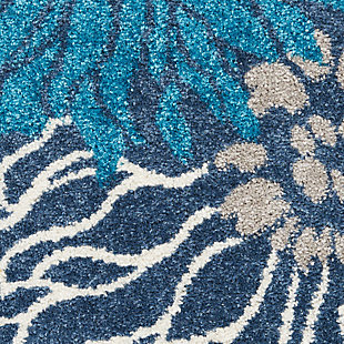 Rich, lush, seductive color draws you in to the plush beauty of the lovely passion collection. If you thrill to the pleasures of beautifying your home, you'll find passion area rugs simply irresistible. These fantastic florals, stunning abstracts and dramatic geometric designs meld elements of classic persian motifs with a modern sensibility. Woven of polypropylene fibers on state-of-the-art powerlooms, this collection of area rugs combines thick, comfortable pile with an easy-care approach. Advanced overdye techniques create an exciting patina effect. Live a more colorful life with passion in your home! Oversized tropical blooms cover the surface of this passion collection rug, but soothing blue, grey, and gold tones help this rug blend into almost any interior style. Soft textures and calming tones bring just the right floral touch to any room.Power loomed | Serged edges | Low shedding | Indoor only | Rug pad recommended