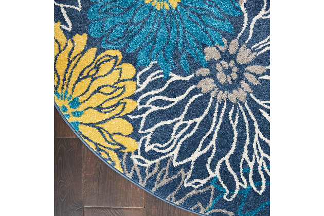 Rich, lush, seductive color draws you in to the plush beauty of the lovely passion collection. If you thrill to the pleasures of beautifying your home, you'll find passion area rugs simply irresistible. These fantastic florals, stunning abstracts and dramatic geometric designs meld elements of classic persian motifs with a modern sensibility. Woven of polypropylene fibers on state-of-the-art powerlooms, this collection of area rugs combines thick, comfortable pile with an easy-care approach. Advanced overdye techniques create an exciting patina effect. Live a more colorful life with passion in your home! Oversized tropical blooms cover the surface of this passion collection rug, but soothing blue, grey, and gold tones help this rug blend into almost any interior style. Soft textures and calming tones bring just the right floral touch to any room.Power loomed | Serged edges | Low shedding | Indoor only | Rug pad recommended