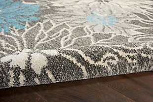 Rich, lush, seductive color draws you in to the plush beauty of the lovely passion collection. If you thrill to the pleasures of beautifying your home, you'll find passion area rugs simply irresistible. These fantastic florals, stunning abstracts and dramatic geometric designs meld elements of classic persian motifs with a modern sensibility. Woven of polypropylene fibers on state-of-the-art powerlooms, this collection of area rugs combines thick, comfortable pile with an easy-care approach. Advanced overdye techniques create an exciting patina effect. Live a more colorful life with passion in your home! Fabulous oversized florals capture the wow! Factor in this passion area rug. Its contemporary flair features a palette of soft charcoal and ivory, enlivened with touches of bright turquoise blue. Soft and inviting, it’s the ideal expression of modern comfort in any room.Power loomed | Easy-care fibers | Low shedding | Indoor only | Rug pad recommended