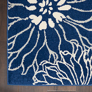 Rich, lush, seductive color draws you in to the plush beauty of the lovely passion collection. If you thrill to the pleasures of beautifying your home, you'll find passion area rugs simply irresistible. These fantastic florals, stunning abstracts and dramatic geometric designs meld elements of classic persian motifs with a modern sensibility. Woven of polypropylene fibers on state-of-the-art powerlooms, this collection of area rugs combines thick, comfortable pile with an easy-care approach. Advanced overdye techniques create an exciting patina effect. Live a more colorful life with passion in your home! Bold is beautiful in this lush, modern floral design from the passion collection. Its oversize, imaginative blooms practically burst the serged-edges of this area rug. A rich and seductive look in magnificent blues and ivory, enhanced with cut pile for superb dimension and texture.Power-loomed | Serged edges | Low shedding | Indoor only | Rug pad recommended