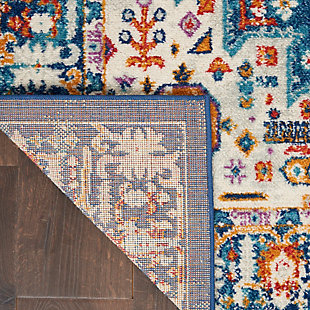 Rich, lush, seductive color draws you in to the plush beauty of the lovely Passion Collection. If you thrill to the pleasures of beautifying your home, you'll find Passion area rugs simply irresistible. These fantastic florals, stunning abstracts and dramatic geometric designs meld elements of classic Persian motifs with a modern sensibility. Woven of polypropylene fibers on state-of-the-art powerlooms, this collection of area rugs combines thick, comfortable pile with an easy-care approach. Advanced overdye techniques create an exciting patina effect. Live a more colorful life with Passion in your home! Sparkling multi-color tones on a rich blue and ivory field make this Passion area rug a lively focal point in rooms ranging from traditional to contemporary. Inspired by classic Persian garden motifs and power-loomed in easy-care fibers for the modern lifestyle. This thick, lush rug is texturized with cut-pile and finished with an ornamental border.Power-loomed | Serged edges | Low shedding | Indoor Only | Rug pad recommended