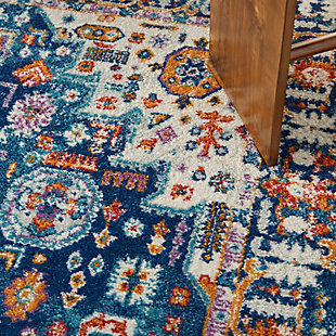 Rich, lush, seductive color draws you in to the plush beauty of the lovely Passion Collection. If you thrill to the pleasures of beautifying your home, you'll find Passion area rugs simply irresistible. These fantastic florals, stunning abstracts and dramatic geometric designs meld elements of classic Persian motifs with a modern sensibility. Woven of polypropylene fibers on state-of-the-art powerlooms, this collection of area rugs combines thick, comfortable pile with an easy-care approach. Advanced overdye techniques create an exciting patina effect. Live a more colorful life with Passion in your home! Sparkling multi-color tones on a rich blue and ivory field make this Passion area rug a lively focal point in rooms ranging from traditional to contemporary. Inspired by classic Persian garden motifs and power-loomed in easy-care fibers for the modern lifestyle. This thick, lush rug is texturized with cut-pile and finished with an ornamental border.Power-loomed | Serged edges | Low shedding | Indoor Only | Rug pad recommended