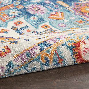 Rich, lush, seductive color draws you in to the plush beauty of the lovely Passion Collection. If you thrill to the pleasures of beautifying your home, you'll find Passion area rugs simply irresistible. These fantastic florals, stunning abstracts and dramatic geometric designs meld elements of classic Persian motifs with a modern sensibility. Woven of polypropylene fibers on state-of-the-art powerlooms, this collection of area rugs combines thick, comfortable pile with an easy-care approach. Advanced overdye techniques create an exciting patina effect. Live a more colorful life with Passion in your home! Softly faded gemstone tones on blue and ivory give this Passion area rug great versatility to work with many color schemes and types of décor. Inspired by classic Persian garden motifs and power-loomed in easy-care fibers for the modern lifestyle. This thick, lush rug is texturized with cut-pile and finished with an ornamental border.Power-loomed | Serged edges | Low shedding | Indoor Only | Rug pad recommended