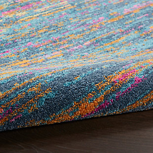 Rich, seductive color draws you into the plush beauty of the Passion Collection. These fantastic florals and dramatic geometric designs meld elements of classic Persian motifs with a bohemian sensibility. Woven from polypropylene fibers on state-of-the-art power looms, this collection of area rugs combines thick, comfortable pile with an easy-care approach. Advanced overdye techniques create an exciting patina effect in shades of pink, blue, and orange. Live a more colorful life with Passion in your home! Like a vista from another planet, this exciting abstract area rug visibly pulsates with colorful energy in sweeping striations across its soft, plush pile. A vivid astral palette with celestial blue, fuchsia and gold is seductively enthralling. Superbly modern in 100% polypropylene fibers with serged edge.Power-loomed | Serged edges | Low shedding | Indoor Only | Rug pad recommended