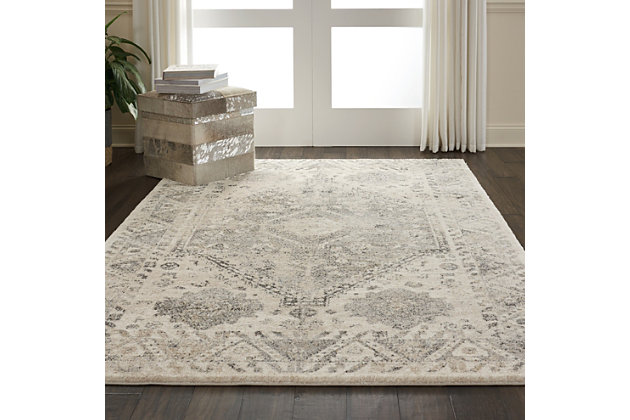 The fusion collection by nourison brings elements from contemporary and traditional rug designs together in rich blues, vibrant pinks, and elegant neutrals. Persian floral patterns and abstract brush strokes play out on silky, plush piles, with distressed color effects to create a vintage appeal. There's a style for any room in your home! This fusion collection rug imbues any room with a distinguished, regal tone, with its wonderfully distressed persian rug design. The ornate border and center medallion add contrasting greys and neutral tones to the plush, beige field, creating the look of an exotic vintage piece.Power loomed | Serged edges | Low shedding | Indoor only | Cut pile