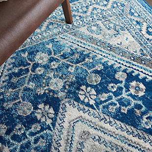 The classic elements of persian rug design are updated for a new generation in the persian vintage collection. The traditional floral motifs, once meant to portray a royal moghul  courtyard garden, now bring a garden of beauty into the modern home. Rich in detail, these lovely, low-pile rugs offer the simplicity of easy-care fibers in 100% polypropylene. The fresh color palettes, gently faded for vintage effect, work perfectly in classic or contemporary decor. With serged edge for a clean finishing touch. The lively and delicate design of this persian vintage area rug is immensely appealing. Its charm is further emphasized by a soft and elegant blue-on-ivory palette that gives this unique rug a soothing effect. Use it to bring calm beauty to any room.Power loomed | Vintage, bohemian style | Low shedding | Easy care- great value | Indoor only