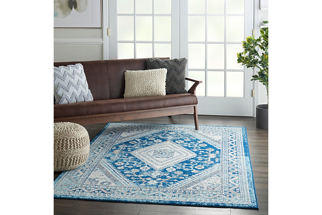 The classic elements of persian rug design are updated for a new generation in the persian vintage collection. The traditional floral motifs, once meant to portray a royal moghul  courtyard garden, now bring a garden of beauty into the modern home. Rich in detail, these lovely, low-pile rugs offer the simplicity of easy-care fibers in 100% polypropylene. The fresh color palettes, gently faded for vintage effect, work perfectly in classic or contemporary decor. With serged edge for a clean finishing touch. The lively and delicate design of this persian vintage area rug is immensely appealing. Its charm is further emphasized by a soft and elegant blue-on-ivory palette that gives this unique rug a soothing effect. Use it to bring calm beauty to any room.Power loomed | Vintage, bohemian style | Low shedding | Easy care- great value | Indoor only
