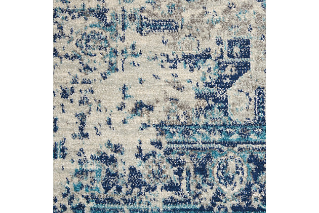 Nourison’s tranquil collection brings together a palette of soothing and elegant colors into an assortment of contemporary and traditional patterns, ranging from contemporary florals to intricate persian and kashan bordered medallion rugs. Each rug features a lush cut pile in easy-care fibers, with subtle abrash tones for touch of calming charm for any decor. A distressed ivory and grey field is adorned with navy blue and a hint of sky blue in this corner-and-medallion kashan rug design from the tranquil collection. Traditional abrash colors lend a vintage flavor to the overall effect, for an antique feel coupled with modern easy-care fibers.Power loomed | Easy-care fibers | Low shedding | Rug pad is recommended | Indoor only
