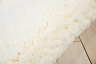 This collection of exciting shag rugs is striking, stylish and spectacular to the touch. Presented in chic monochromatic color palettes and designed in exciting shapes and sizes, each rug is hand tufted and fabricated with an ultra-plush pile to create an invitingly intimate and eclectic environment. With its artfully understated monochromatic ivory color palette, hand tufting and positively plush pile, this cozy and contemporary shag rug is as striking to look at and as it is sensational underfoot. Expertly crafted from a fantastically long-wearing and low-maintenance 100% polyester.Hand tufted | Easy-care fibers | Low shedding | Indoor only; rug pad recommended | 0