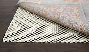 Nourison's gridloc rug pad gives your area rug affordable protection for hard surfaces like tile and hard wood, keeping your rugs in place without tape or tacky residue. By reducing slippage and providing additional cushioning and support, each rug pad helps your favorite rug last longer and stay fresher while also keeping your favorite rooms safer. The open-weave design of each pad helps hold the rug in place, while also providing improved air circulation to minimize moisture and help vacuums perform better.Machine made | Non-slip | Indoor only; rug pad recommended | 0