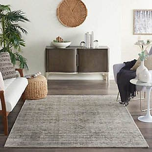 Highly refined and infinitely elegant, this thrilling collection features an alluring array of antique-inspired designs and incandescent color palettes to impart an air of sumptuous sophistication to any interior. Expertly hand loomed from supremely shiny and silky yarns and created with a beautiful tip-sheered loop pile, each resplendent area rug is outstanding in its look and feel. This transitional floral and diamond design gets a contemporary kick thanks to glamorously gradated tones of grey, white, and subtle blue. Hand loomed from splendidly shining threads, this versatile, terrifically-textured area rug is enticingly at home in both traditional and modern settings.100% rayon | 100% rayon | Hand loomed | Tip-sheared loop pile | Low shedding | Indoor only; rug pad recommended | Imported
