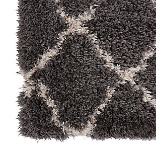With a shag pile deep enough to lose yourself in, the nourison luxe shag area rug collection brings a warm, luxurious touch to your home, woven on state-of-the-art looms for excellent durability. This collection features sleek solid greys and neutral tones as well as traditional moroccan lattice designs, with plush 2-inch flokati shag pile for comfort that never goes out of style. This exceptionally plush 2-inch-deep shag rug from the nourison luxe shag collection has the look and feel of luxuriously soft sheepskin, and makes a perfect addition to any casual room setting. Luxurious texture and moroccan lattice pattern on deep grey color for a warm, soothing accent.100% polyester | 100% polyester | Power loomed | Serged edges | Low shedding | Indoor only; rug pad recommended | Imported