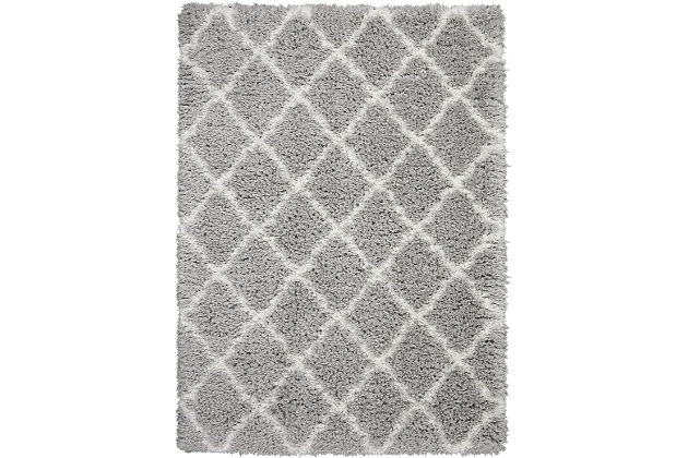 With a shag pile deep enough to lose yourself in, the nourison luxe shag area rug collection brings a warm, luxurious touch to your home, woven on state-of-the-art looms for excellent durability. This collection features sleek solid greys and neutral tones as well as traditional moroccan lattice designs, with plush 2-inch flokati shag pile for comfort that never goes out of style. This exceptionally plush 2-inch-deep shag rug from the nourison luxe shag collection has the look and feel of luxuriously soft sheepskin, and makes a perfect addition to any casual room setting. Luxurious texture and moroccan lattice pattern on pale grey color for a warm, soothing accent.100% polyester | 100% polyester | Power loomed | Serged edges | Low shedding | Indoor only; rug pad recommended | Imported