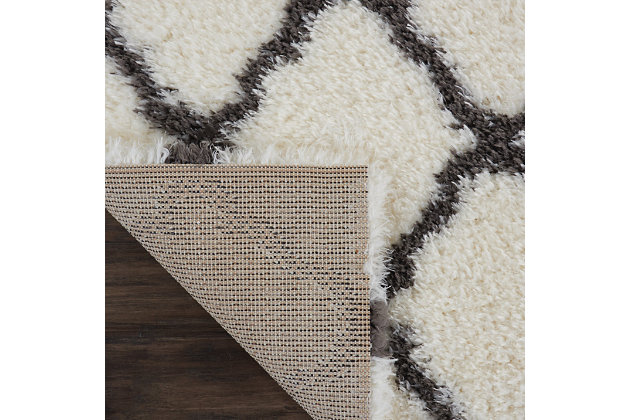 With a shag pile deep enough to lose yourself in, the nourison luxe shag area rug collection brings a warm, luxurious touch to your home, woven on state-of-the-art looms for excellent durability. This collection features sleek solid greys and neutral tones as well as traditional moroccan lattice designs, with plush 2-inch flokati shag pile for comfort that never goes out of style. This exceptionally plush 2-inch-deep shag rug from the nourison luxe shag collection has the look and feel of luxuriously soft sheepskin, and makes a perfect addition to any casual room setting. Luxurious texture and moroccan lattice pattern on soft ivory color for a warm, soothing accent.100% polyester | 100% polyester | Power loomed | Serged edges | Low shedding | Indoor only; rug pad recommended | Imported