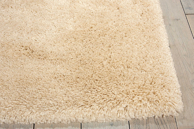 We couldn’t resist naming this cozy and contemporary collection from ® by Nourison after its delicious tone and texture. Lush and lavish, each sumptuous shag rug is fabricated for exceptionally long wear and easy maintenance, with a positively posh and plush look and feel. Available in an enticing array of gorgeous neutral shades to impart an inviting intimacy to any interior. Warm and welcoming with a thrilling tone and texture, this sensational shag rug is striking, stylish and spectacular to the touch. In a beautiful bone shade to lend an irresistible and easy elegance to any decor. Our Yummy Shag rug lives in our Americana Style Guide.100% Polypropylene | 100% Polypropylene | Loom woven | Serged edges | Low shedding | Indoor Only; Rug Pad Recommended | Imported