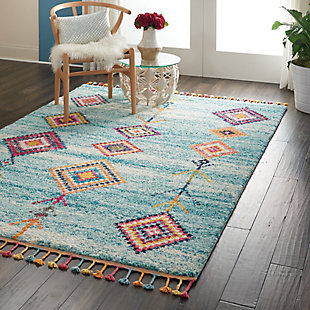 The nomad collection transports you to a vibrant and colorful moroccan rug market, with richly hued tribal rugs that feature a combination of exciting designs, multicolor fringes, and plush, luxurious fibers. Irregular diamond designs on dramatic abrash fields will bring a sense of global inspiration and energy to any room in your home. Hand-drawn diamond patterns and figures grace a deeply striated blue and ivory field, creating a truly arresting tribal decor statement with this nomad collection rug. Soft, low-pile shag texture and braided tassel finish make this the perfect accent rug for casual comfort, bringing a skandinavian influence to your favorite room.100% polypropylene | Power loomed | Serged edges | Low shedding | Indoor only | Imported