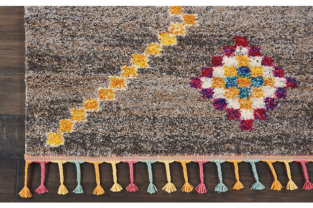 The nomad collection transports you to a vibrant and colorful moroccan rug market, with richly hued tribal rugs that feature a combination of exciting designs, multicolor fringes, and plush, luxurious fibers. Irregular diamond designs on dramatic abrash fields will bring a sense of global inspiration and energy to any room in your home. Hand-drawn diamond patterns and figures grace a deeply striated gray field, creating a truly arresting tribal decor statement with this nomad collection rug. Soft, low-pile shag texture and braided tassel finish make this the perfect accent rug for casual comfort, bringing a moroccan influence to your favorite room.100% polypropylene | Power loomed | Serged edges | Low shedding | Indoor only | Imported
