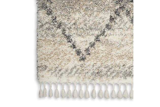 With contemporary hues and clean lines, nourison's oslo collection reflects a scandinavian influence in these plush shag rugs. These thick, inviting rugs feature easy-care fibers with twisted fringe finish for an authentic tribal look and feel, featuring lattice and diamond designs in rich grays and soothing neutral colors. Each rug adds a layer of warmth and welcome to any space in your home. Warm neutral tones of ivory and gray create a subtle mottled background for the lattice grid of this scandinavian tribal rug from nourison's oslo collection. With a look that brings contemporary and ancient styles together, this rug is at home in any decor setting, with easy-care fibers and plush, welcoming shag texture.100% polypropylene | Power loomed | Easy-care fibers | Low shedding | Shag | Indoor only | Imported
