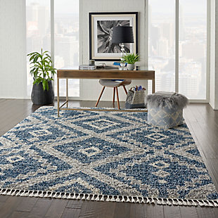 Bold tribal geometrics strike a scandinavian note in this sumptuous shag rug from the oslo collection. Rich denim blue, gray, and ivory blend in with a range of color schemes and decors, for a flexible and luxurious addition to any room.100% polypropylene | Power loomed | Easy-care fibers | Low shedding | Shag | Indoor only | Imported