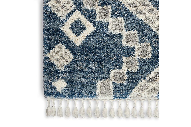 Bold tribal geometrics strike a scandinavian note in this sumptuous shag rug from the oslo collection. Rich denim blue, gray, and ivory blend in with a range of color schemes and decors, for a flexible and luxurious addition to any room.100% polypropylene | Power loomed | Easy-care fibers | Low shedding | Shag | Indoor only | Imported
