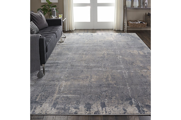 At home in a country cabin or urban loft, the rustic textures collection from nourison blends earthen tones and contemporary abstracts together in beautifully textured modern rugs that are sure to bring a rustic sensibility to any decor. Deep grays mottled with beige and cream create an artisticaly abstract visual on this beautifully carved contemporary rug from the rustic textures collection. Distressed color effects and intricate high-low pile construction create a thoroughly modern rug, with silky smooth texture that add an urban appeal to any space.51% polypropylene, 49% polyester | Power loomed | Serged edges | Low shedding | Indoor only | Imported