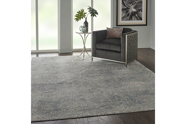 At home in a country cabin or urban loft, the rustic textures collection from nourison blends earthen tones and contemporary abstracts together in beautifully textured modern rugs that are sure to bring a rustic sensibility to any decor. This rustic textures collection rug uses its carved pile to accent a wonderfully ornate persian rug design in an ivory-on-ivory pattern, with traces of slate blue and gray bringing the bordered pattern into clearer view. This vintage rug brings an understated elegance to any space, with easy-care fibers for years of enjoyment.41% polypropylene, 59% polyester | Power loomed | Serged edges | Low shedding | Indoor only | Imported