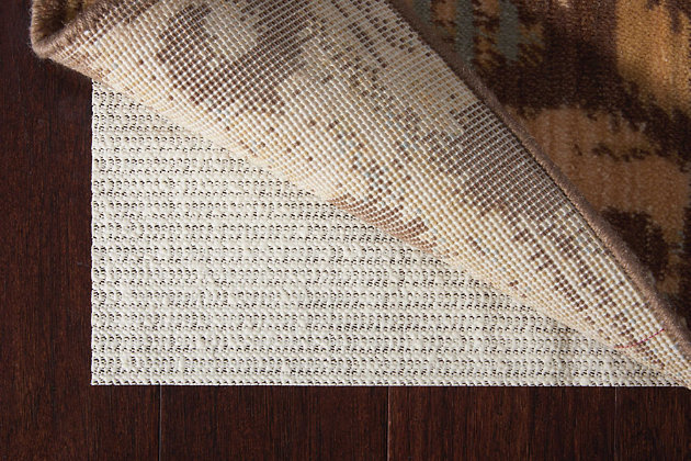 Nourison's shiftloc rug pad gives your area rug affordable protection for hard surfaces like tile and hard wood, keeping your rugs in place without tape or tacky residue. By reducing, each rug pad helps your favorite rug last longer and stay fresher while also keeping your favorite rooms safer. The open-weave design of each pad helps hold the rug in place, while also providing improved air circulation to minimize moisture and help vacuums perform better.90% pvc, 10% polyester | Power loomed | Serged edges | Moderate shedding | Low-loop, high-plush texture and a luminous neutral color field brings to life the sophisticated abstract designs of the zermatt collection. | Indoor only | Imported