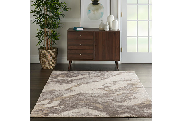 Nourison's silky textures collection of contemporary low-profile area rugs provides an infusion of modern style to your home, with designs ranging from eclectic mid-century to abstract to traditional persian design. The allure is in the sleek, soft pile, featuring a silky sheen that brings fashionable flair to match any decor in your favorite room. Exciting marbleized effects send swirls of luminous earth tones across this fascinating silky textures rug. It's a masterwork of textile design in a palette of warm, modern neutrals. Ideal for a contemporary touch in any room.50% viscose, 50% polyester | Power loomed | Distressed finish | Low shedding | 0 | Imported