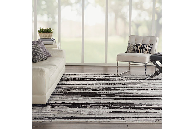 Modern sophistication meets classic comfort in the urbane zermatt collection. These superbly made area rugs combine low loop and high-plush pile to create a beautifully dimensional texture that brings depth to the captivating abstract designs. Striations and a luminous neutral color field create a painterly effect that simulates the hand of an artist. A borderless design and serged edges give it a clean, modern look. Make an instant style statement in your home with the unmistakable chic of a zermatt area rug. The rich contrast of deep charcoal with luminous ivory brings this minimalist zermatt area rug to maximum elegance. Its abstract design is beautifully enhanced by dimensional, high-low pile combining low-loop and high-plush textures. Striations accent its textural appeal. A superbly versatile finishing touch for the modern, sophisticated room.100% polyester | Power loomed | Serged edges | Moderate shedding | Low-loop, high-plush texture and a luminous neutral color field brings to life the sophisticated abstract designs of the zermatt collection. | 0 | Imported