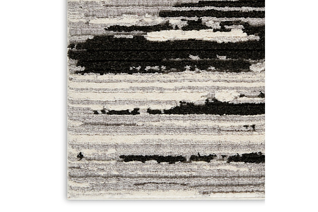 Modern sophistication meets classic comfort in the urbane zermatt collection. These superbly made area rugs combine low loop and high-plush pile to create a beautifully dimensional texture that brings depth to the captivating abstract designs. Striations and a luminous neutral color field create a painterly effect that simulates the hand of an artist. A borderless design and serged edges give it a clean, modern look. Make an instant style statement in your home with the unmistakable chic of a zermatt area rug. The rich contrast of deep charcoal with luminous ivory brings this minimalist zermatt area rug to maximum elegance. Its abstract design is beautifully enhanced by dimensional, high-low pile combining low-loop and high-plush textures. Striations accent its textural appeal. A superbly versatile finishing touch for the modern, sophisticated room.100% polyester | Power loomed | Serged edges | Moderate shedding | Low-loop, high-plush texture and a luminous neutral color field brings to life the sophisticated abstract designs of the zermatt collection. | 0 | Imported