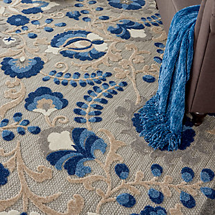 This sunny and sensational collection of flat woven indoor/outdoor rugs is pretty, practical and simply perfect for high traffic areas. With its inviting assortment of classic and contemporary designs, tempting color palettes and terrific textures, these multipurpose rugs will afford an air of simple sophistication to any environment. In swirling vines and flowers of blue, turquoise, cream and grey, this nourison outdoor rug complements your patio, porch or poolside setting. High-low textures combine plush patterns with an intricately woven base for exceptional look and feel that will stand up under any conditions. Created from premium stain-resistant fibers for long wear, low maintenance, and a splendid texture.100% polypropylene | Power loomed | Hand carved | Low shedding | Indoor-outdoor | Cheerful colors and sturdy construction make these indoor/outdoor rugs a perfect centerpiece for any patio, deck or porch. | Imported