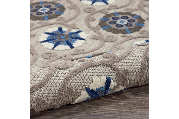 This sunny and sensational collection of flat woven indoor/outdoor rugs is pretty, practical and simply perfect for high traffic areas. With its inviting assortment of classic and contemporary designs, tempting color palettes and terrific textures, these multipurpose rugs will afford an air of simple sophistication to any environment. This outdoor rug from the aloha collection features soft cut pile and textural woven patterns in bursts of color sure to enliven any outdoor space. Floral patterns in blue, turquoise, cream and grey add a festive touch of the tropics to your patio or deck.  created from premium stain-resistant fibers for long wear, low maintenance, and a splendid texture.100% polypropylene | Power loomed | Hand carved | Low shedding | Indoor-outdoor | Cheerful colors and sturdy construction make these indoor/outdoor rugs a perfect centerpiece for any patio, deck or porch. | Imported