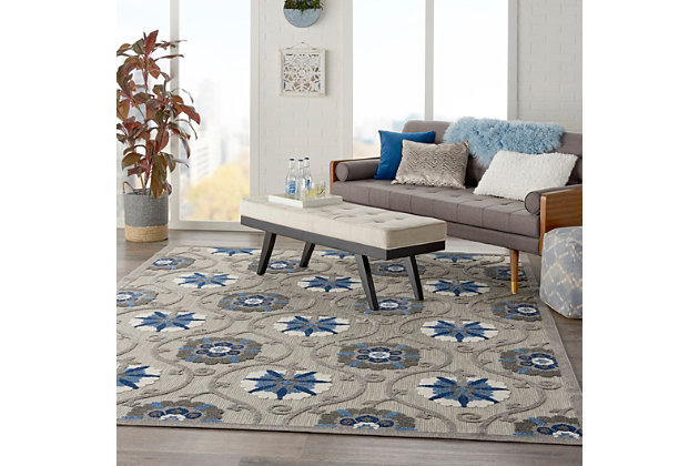 This sunny and sensational collection of flat woven indoor/outdoor rugs is pretty, practical and simply perfect for high traffic areas. With its inviting assortment of classic and contemporary designs, tempting color palettes and terrific textures, these multipurpose rugs will afford an air of simple sophistication to any environment. This outdoor rug from the aloha collection features soft cut pile and textural woven patterns in bursts of color sure to enliven any outdoor space. Floral patterns in blue, turquoise, cream and grey add a festive touch of the tropics to your patio or deck.  created from premium stain-resistant fibers for long wear, low maintenance, and a splendid texture.100% polypropylene | Power loomed | Hand carved | Low shedding | Indoor-outdoor | Cheerful colors and sturdy construction make these indoor/outdoor rugs a perfect centerpiece for any patio, deck or porch. | Imported