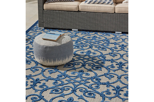 This sunny and sensational collection of flat woven indoor/outdoor rugs is pretty, practical and simply perfect for high traffic areas. With its inviting assortment of classic and contemporary designs, tempting color palettes and terrific textures, these multipurpose rugs will afford an air of simple sophistication to any environment. This outdoor rug from the aloha collection features soft cut pile and a textural woven scroll pattern sure to enliven any outdoor space. Complementary tones of navy, light blue and beige make for a colorful centerpiece for your patio or deck.  created from premium stain-resistant fibers for long wear, low maintenance, and a splendid texture.100% polypropylene | Power loomed | Hand carved | Low shedding | Indoor-outdoor | Cheerful colors and sturdy construction make these indoor/outdoor rugs a perfect centerpiece for any patio, deck or porch. | Imported