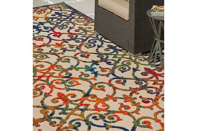 This sunny and sensational collection of flat woven indoor/outdoor rugs is pretty, practical and simply perfect for high traffic areas. With its inviting assortment of classic and contemporary designs, tempting color palettes and terrific textures, these multipurpose rugs will afford an air of simple sophistication to any environment. This aloha collection rug features a rainbow of ombre colors ranging across an ornate textured pattern that works in indoor our outdoor settings. Textured patterns on a woven ivory field feature premium stain-resistant fibers for durability and easy cleaning - simply clean and rinse.100% polypropylene | Power loomed | Serged edges | Low shedding | Indoor-outdoor | Cheerful colors and sturdy construction make these indoor/outdoor rugs a perfect centerpiece for any patio, deck or porch. | Imported