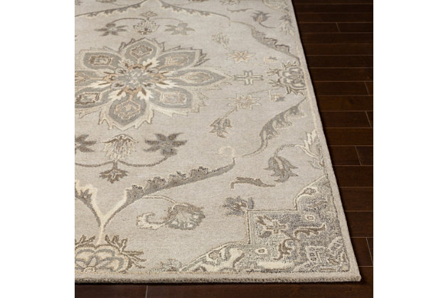 Showcasing a traditional inspired design that exemplifies timeless style, of elegance and sophistication. Hand-tufted in India with 100% wool, this piece offers an affordable alternative to other handmade constructions while preserving the same natural demeanor and charm. 100% wool | Hand Tufted | Imported | Canvas Backing | Spot clean