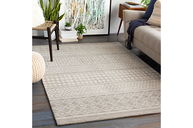 Featuring compelling global-inspired designs, this rug is everything you've been searching for and more. This handmade piece is a perfect addition to your home and will add eclectic charm to any space. Tufted by hand with quality wool in India, it features a low pile and is an affordable and charming option.100% wool | Hand Tufted | Imported | Minimal Shedding | Spot clean