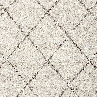 Texture and substance meet style and color with this area rug. This sensational shag is elevated with a trend-setting cream and gray diamond pattern. Lavish pile makes this rug a haven for your feet. Who knew beautiful home fashion could feel so good?100% polypropylene | Machine woven | Jute bac; rug pad recommended | Imported | Spot clean