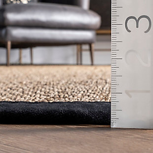 The casual style of this natural fiber rug fosters an inviting feel in entryways, living rooms, and dining rooms alike. The non-skid backing helps it stay put on hardwood flooring, while the simple border helps bring definition to open layouts.100% seagrass | Machine made | Easy to clean and maintain | Imported