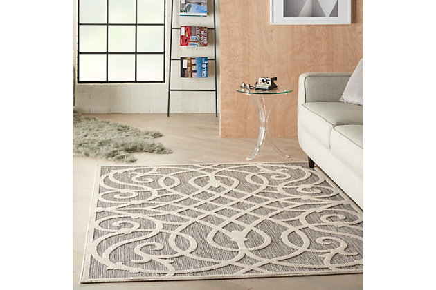 Can a rug sturdy enough for both indoor and outdoor use also be chic and attractive? For sure, if it’s from the cozumel collection. These durable and fade-resistant area rugs are ideal for the casual lifestyle and work just as well in covered outdoor locations such as patio or porch as they do in your living room, family room or other favorite spot. Distinguished by their high-low loop pile, cozumel area rugs take a visual cue from hand-carved rugs but are easily affordable and designed to withstand wear. This contemporary collection ranges from linear and geometric to sprightly florals – all enhanced by dimensional pile in today’s most coveted neutral tones. Decorating is easy (and fun!) with the casual chic of textural cozumel, power-loomed in modern poly-fibers. Enliven your home or special outdoor space with the curve appeal of this cozumel area rug! Bold geometric lines swirl across it, in a lively diamond-and-curlicue design. Texturally enhanced with high-low loop pile, in a harmony of soft greys.100% polypropylene | Power loomed | Narrow border | Low shedding | Indoor-outdoor | High-low loop pile | Imported