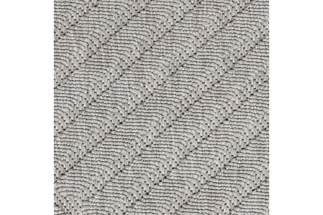 Can a rug sturdy enough for both indoor and outdoor use also be chic and attractive? For sure, if it’s from the cozumel collection. These durable and fade-resistant area rugs are ideal for the casual lifestyle and work just as well in covered outdoor locations such as patio or porch as they do in your living room, family room or other favorite spot. Distinguished by their high-low loop pile, cozumel area rugs take a visual cue from hand-carved rugs but are easily affordable and designed to withstand wear. This contemporary collection ranges from linear and geometric to sprightly florals – all enhanced by dimensional pile in today’s most coveted neutral tones. Decorating is easy (and fun!) with the casual chic of textural cozumel, power-loomed in modern poly-fibers. A striking geometric design celebrates texture with a high-low loop pile in crisp squares and stripes. This chic and contemporary cozumel area rug creates a subtle focal point in any indoor or protected outdoor location. A versatile decorating accent in misty light grey.100% polypropylene | Power loomed | Narrow border | Low shedding | Indoor-outdoor | High-low loop pile | Imported