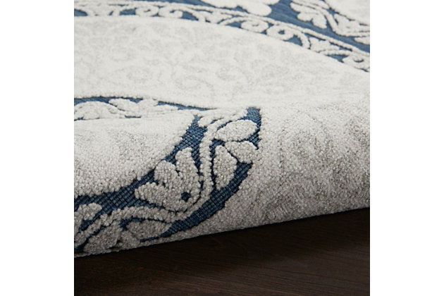 With a palette of rich blues, mysterious greys and smoky taupes, key largo offers a fresh and sophisticated look in an indoor/outdoor rug collection. These easy-care, low-shed beauties have the special, textural touch of cut-and-loop pile, so unusual in a casual rug collection. They bring unexpected elegance to your poolside, patio, porch or balcony, and are ideal for your beach home or any indoor location. The contemporary and transitional designs are flat power-loomed of 60% polypropylene and 40% polyester, so you can vacuum or hose-rinse and air-dry them with minimum fuss and maximum style impact! Circular thinking makes a great design statement! This medallion-motif area rug from the key largo collection is a versatile and elegant choice for any location, indoor or outdoor. Power-loomed in luxurious indigo blue with the special quality of cut-and-loop pile.60% polypropylene, 40% polyester | Power loomed | Indoor/outdoor | Low shedding | Textured flat weave with elegant cut-and-loop pile offers a fresh and sophisticated look for this indoor/outdoor rug collection. | Low pile | Imported