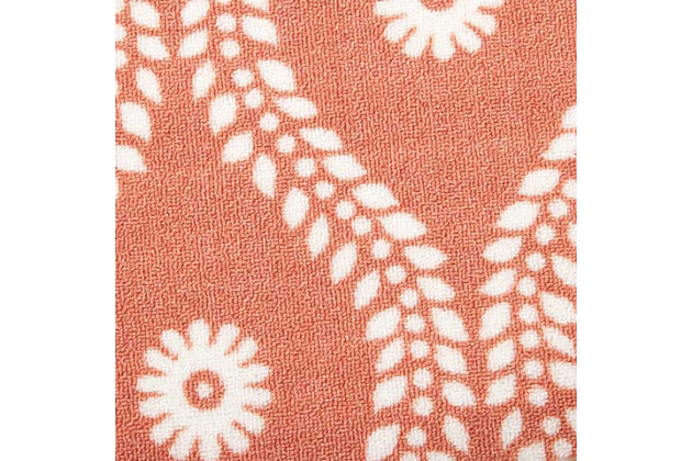 Add some excitement to any surrounding with these magnificent indoor/outdoor rugs. Floral, scrollwork, and animal-skin patterns in vivid color make this a truly eye-catching collection. These versatile rugs are beautiful to look at, soft to walk on, and easy to clean with just a hose. Leafy vines trace sinuous arabesques down a russet field, each curve centered by a fresh blossom. The warm terra-cotta shade is perfect for a summery feel in the home or on the patio. Enjoy its casual luxury in a rug designed for easy living.100% polyester | Power loomed | Serged edges | Low shedding | Easy to clean, simply rinse with a hose | Low pile | Imported