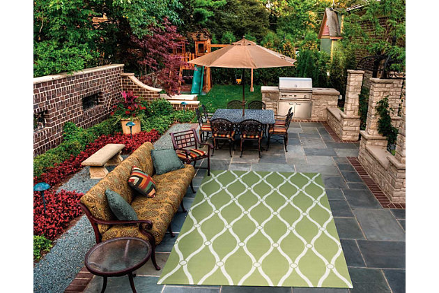 Add some excitement to any surrounding with these magnificent indoor/outdoor rugs. Floral, scrollwork, and animal-skin patterns in vivid color make this a truly eye-catching collection. These versatile rugs are beautiful to look at, soft to walk on, and easy to clean with just a hose. An elegantly contemporary trellis design in upbeat tones of garden green. Expertly machine printed, a marvelously versatile indoor/outdoor rug for today's casual lifestyle. Easy to care for and perfect for almost any outdoor use. Just clean with a garden hose and enjoy years of lasting beauty.100% polyester | Power loomed | Serged edges | Low shedding | Easy to clean, simply rinse with a hose | Low pile | Imported
