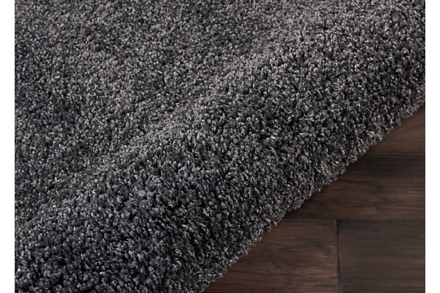 Inspired by glamorous socal interior design, the malibu collection of shag area rugs from nourison are utterly lavish in their look and feel. Each rug is expertly designed in distinctive sizes and shapes to perfectly fit any room, featuring a sumptuously thick 1-inch pile and a marvelous power-loomed fabrication for plush texture and stunning sheen. With its positively plush and lush fabrication, fabulously thick pile and sensational sheen, this malibu shag area rug from nourison is as extravagant to the eye as it is underfoot. In a dramatic shade of dark grey, this sensational power loomed shag rug will bring a fashion-forward flair to any room.100% polypropylene | Power loomed | Serged edges | Low shedding | Indoor only | Shag pile | Imported