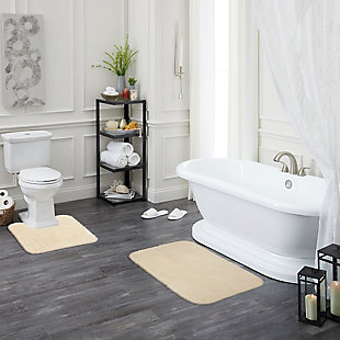 Create your own soothing spa-like experience with the Mohawk Cream Duo Bath Rug, available in size 1' 8"x2' 8". Durably designed with our machine tufted construction, this bath mat is crafted with stain resistant 100% nylon yarn and backed with the security of non-skid latex. Featuring a modern cream hue, this luxuriously soft bath rug will effortlessly add a cozy cushion of cloud-like comfort.Machine Tufted | Cut Pile | 100% Nylon | Made in the USA