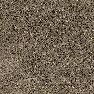Create your own soothing spa-like experience with the Mohawk Taupe Duo Bath Rug, available in size 1' 8"x1' 10". Durably designed with our machine tufted construction, this bath mat is crafted with stain resistant 100% nylon yarn and backed with the security of non-skid latex. Featuring a modern tan hue, this luxuriously soft bath rug will effortlessly add a cozy cushion of cloud-like comfort.Machine Tufted | Cut Pile | 100% Nylon | Made in the USA
