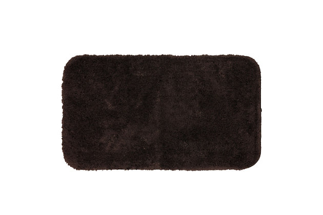 Create the ultimate oasis in your bath with the plush softness of the Riverside Bath Rug, available in velvety dark chocolate brown. Machine tufted for quality and crafted with the irresistible comfort of premium moisture absorbent nylon yarn, the durable design of this bath rug will remain resilient despite daily useMachine Tufted | Cut Pile | 100% Nylon | Made in the USA