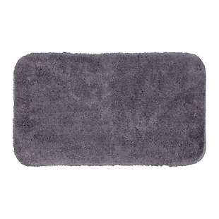 Create the ultimate oasis in your bath with the plush softness of the Riverside Bath Rug, available in timeless black. Machine tufted for quality and crafted with the irresistible comfort of premium moisture absorbent nylon yarn, the durable design of this bath rug will remain resilient despite daily useMachine Tufted | Cut Pile | 100% Nylon | Made in the USA